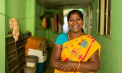 Smiling woman in a colourful sari.