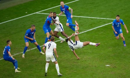 England’s Jude Bellingham scores his side’s first goal with an overhead kick against Slovakia at Euro 2024