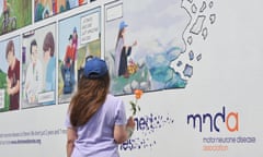 Heather Smith stands in front of poster