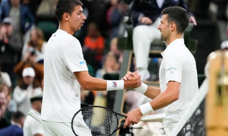Alexei Popyrin congratulates Novak Djokovic after their match