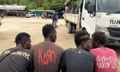 Men in Bougainville, Papua New Guinea, wearing heavy metal band t-shirts.