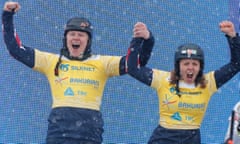 Gold medal winners Huw Nightingale and Charlotte Bankes of Great Britain celebrate at the snowboard world championships in Georgia.