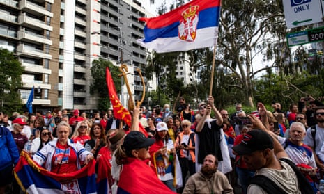 Australian Open: crowds of Novak Djokovic supporters rally outside the Park hotel – video