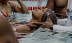 A swimmer learns to float during a free swimming lesson organized by Black People Will Swim at York College in Jamaica, Queens, New York, on Thursday, June 20th, 2024.