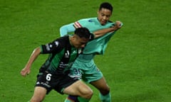 Tomoki Imai of second-placed Western United competes with Perth’s Joseph Forde during the last-placed Glory’s 6-0 loss on Saturday.