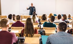 Stock photo of tutor giving lecture to room of students