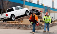 US-HEALTH-VIRUS-AUTO<br>Construction workers leave FCA Chrysler Warren Truck Assembly after the Detroit three automakers have agreed to UAW demands to shut down all North America plants as a precaution against coronavirus. on March 18, 2020 in Detroit, Michigan. - This plant produces the Ram 1500 trucks. (Photo by JEFF KOWALSKY / AFP) (Photo by JEFF KOWALSKY/AFP via Getty Images)