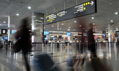 Passengers walk through Melbourne airport