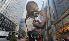 People participate in a protest of restaurant workers in New York City<br>People hold 'Elena the Essential Worker' a 24-foot statue reminiscent of the famous Rosie the Riveter, during a protest of restaurant workers who demonstrated demanding to be paid full minimum wage with tips due to risking exposure to the coronavirus disease (COVID-19) as local restaurants commence indoor dining in Manhattan, New York City, U.S., September 30, 2020. REUTERS/Andrew Kelly