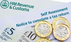 HMRC self-assessment notice to complete a UK tax return with new pound coins and notes money to pay taxes