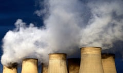 Smoke billowing from power station chimneys