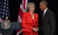 UK Prime Minister Theresa May shakes US President Barack Obama's hand in front of UK and US flags