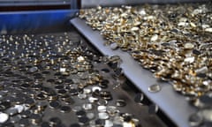 Blank coins on a conveyor belt