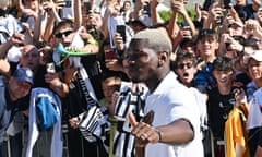 Paul Pogba is greeted by supporters as he arrives at the Juventus medical centre in Turin on Monday