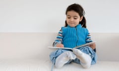 Little girl pretending to read a book