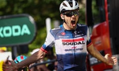 Kasper Asgreen celebrates after crossing the line on the 18th stage of the Tour de France.