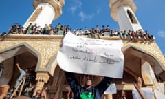 Libyans protest outside a mosque a week after the deadly floods in Derna