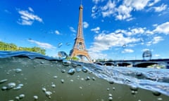 The Eiffel Tower is seen from the water of the Seine River, where a men’s triathlon event was rescheduled due to water quality.