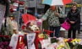 A woman pays her respects at a makeshift memorial on Yonge Street following a van that attacked multiple people in Toronto, Ontario, Canada, April 25, 2018. REUTERS/Carlo Allegri