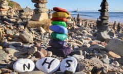 A pebble stack in recognition for the NHS which has been added to hundreds on the beach at Whitley Bay.
