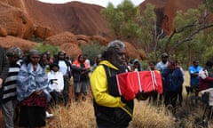 An emotional Abraham Poulson takes Yokun's remains to the ceremony. Photograph by Dean Sewell/Oculi for Guardian Australia.