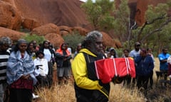An emotional Abraham Poulson takes Yukun's remains to the ceremony. Photograph by Dean Sewell/Oculi for Guardian Australia.