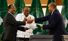 Redwan Hussein, left, representing Ethiopia’s government, shakes hands with Tigray’s delegate Getachew Reda at a press conference in Pretoria.