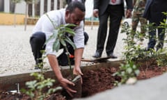 The prime minister, Ahmed Abiy, plants a tree in Addis Ababa, Ethiopia.