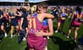 Brisbane’s Dakota Davidson (right) celebrates with her Lions teammates after beating North Melbourne in the 2023 AFLW grand final at Ikon Park. 