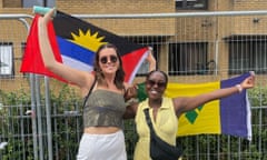 Sarah (left) and Joanna posing with the flags of Antigua and Barbuda and St Vincent and the Grenadines respectively in London, 2021