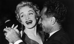 Post Premiere Party<br>13th October 1954: German actor Marlene Dietrich (1901 - 1992) laughs as she dances with Turkish-born film director Elia Kazan (1909 - 2003) at the after-premiere party for director George Cukor's film, 'A Star is Born,' hosted by film executive and producer Jack L Warner, Cocoanut Grove, Ambassador Hotel, Los Angeles, California. (Photo by Hulton Archive/Getty Images) white;format portrait;male;female;Film;film actress;film director;Personality;German;Turkish;North America;G2346/093; outonthefloor