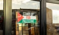 A ‘Stand up for Palestine’ sign' in a shop window in Bury Park in Luton. 