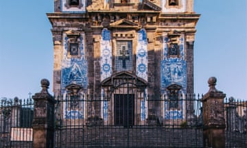 Rhapsody in blue Around 11,000 azulejo tiles cover the outside of the Igreja de Santo Ildefonso. The church was built in the 18th century, but the tiles, painted by the artist Jorge Colaço, were only added in 1932. They are now in dire need of renovation.