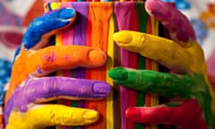 Close-up of woman holding multicolored paint