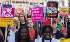Demonstrators gather outside the BBC Broadcasting House ahead of a march as part of United Nations Anti-Racism Day in London, United Kingdom on March 19, 2022