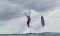 Brazil's Gabriel Medina celebrates in supernatural style after making a difficult tube section in the fifth heat of the men's surfing at Teahupo’o during the Paris Olympics.