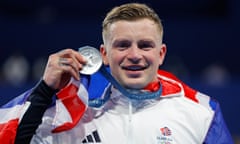 Adam Peaty poses with his silver medal after the men’s 100m breaststroke final at the Paris 2024 Olympic Games.