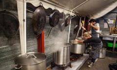 Help Refugees volunteers cooking and preparing food for the refugees at the Calais refugee camp