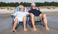 Couple in sunloungers at the beach