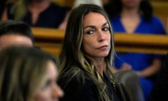 a woman watches as jurors are seated