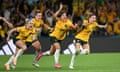 Ellie Carpenter, Caitlin Foord, Sam Kerr and Steph Catley of Australia celebrate winning after Cortnee Vine of Australia kicked a successful penalty goal to defeat France in the Fifa Women's World Cup 2023 quarter final