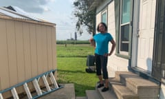 Barbara Washington, a local environmental campaigner, with the Nucor steel plant seen behind her.