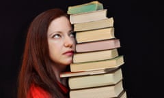 Woman holding a pile of books