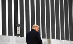 Donald Trump signs a plaque as he tours a section of the border wall in Alamo, Texas, on 12 January 2021.