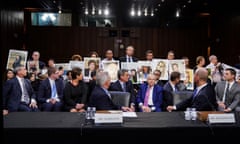 Boeing's Muilenburg and Hamilton testify before Senate Commerce, Science and Transportation hearing on grounded 737 MAX on Capitol Hill in Washington<br>John Hamilton, vice president and chief engineer of Boeing Commercial Airplanes, and Boeing Chief Executive Dennis Muilenburg look back at family members holding photographs of Boeing 737 MAX crash victims as Hamilton and Muilenburg testify before a Senate Commerce, Science and Transportation Committee hearing on “aviation safety” and the grounded 737 MAX after two deadly 737 MAX crashes killed 346 people, on Capitol Hill in Washington, U.S., October 29, 2019. REUTERS/Sarah Silbiger TPX IMAGES OF THE DAY