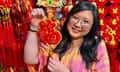 Comedian Jennifer Wong holds up a lunar new year decoration with the Chinese character for the word ‘luck’