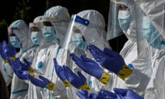 Malaysian workers in protective clothing during the pandemic.