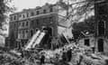 A bus is left leaning against the side of a building in the aftermath of a German bombing raid on London in the first days of the blitz, 9th September 1940.