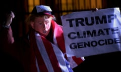 A man wearing a mask depicting U.S. President-Elect Donald Trump protests during a demonstration against climate change outside of the U.S. Embassy in London, Britain on November 18, 2016. REUTERS/Hannah McKay/File Photo