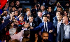 Emmanuel Macron greets supporters on Saturday at the Paris La Défense arena.